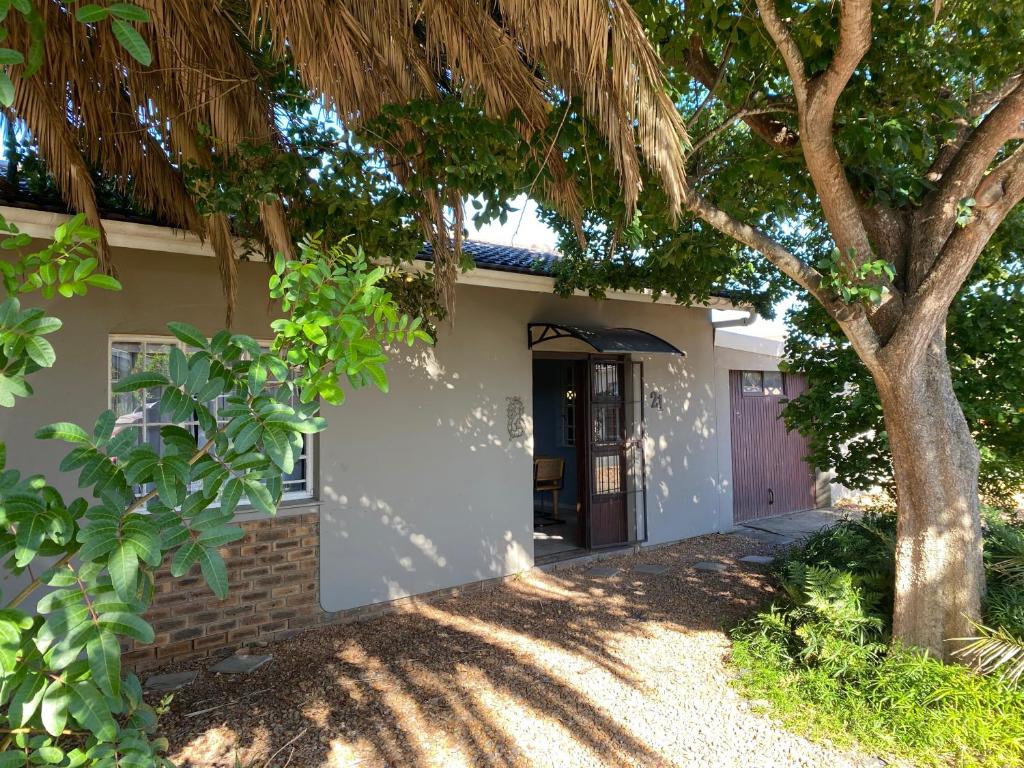 a house with a tree in front of it at Manasseh in Riversdale