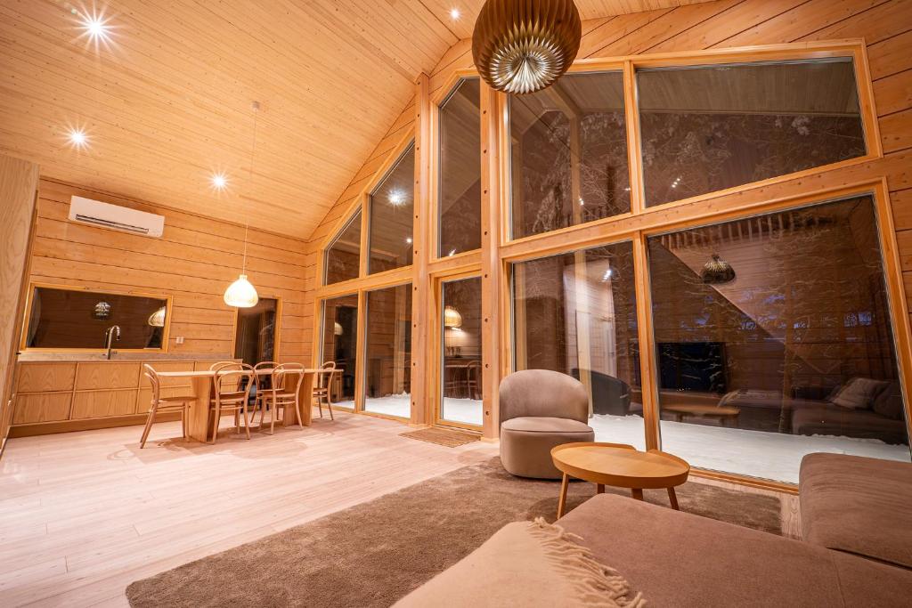 a living room with a couch and a table at Lakeside Cabin in Romakkaniemi