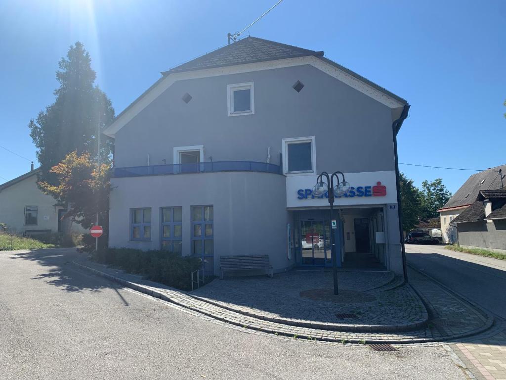 a large white building on the side of a road at Wohnung Nähe Steyr bis 9 Personen in Ramingdorf