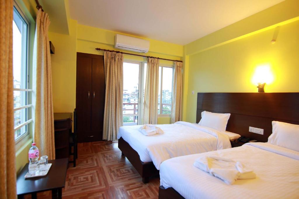 Katil atau katil-katil dalam bilik di My Hotel Pvt Ltd