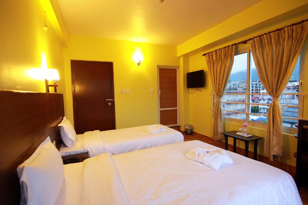Katil atau katil-katil dalam bilik di My Hotel Pvt Ltd