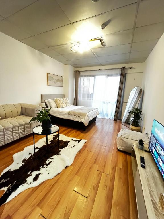 a living room with a couch and a table at High Rise Haven 2 in Johannesburg