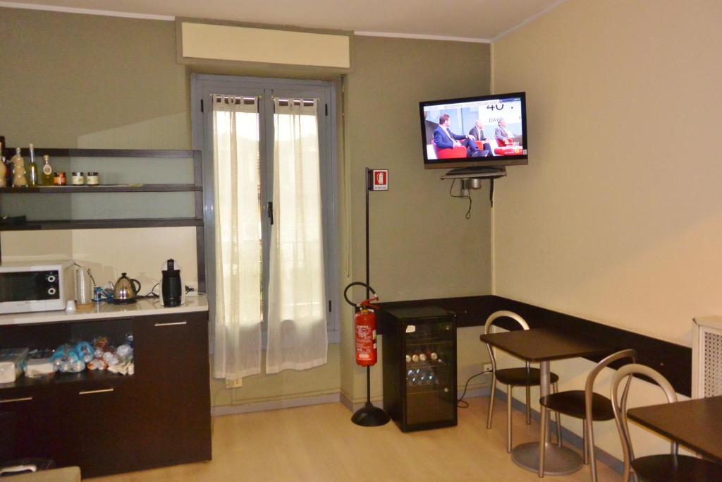 TV a/nebo společenská místnost v ubytování Hotel Arno