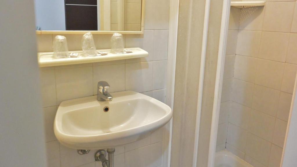 Koupelna v ubytování Hotel Arno