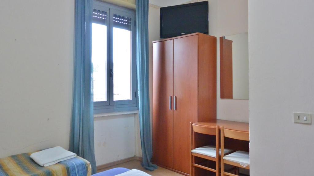 TV a/nebo společenská místnost v ubytování Hotel Arno
