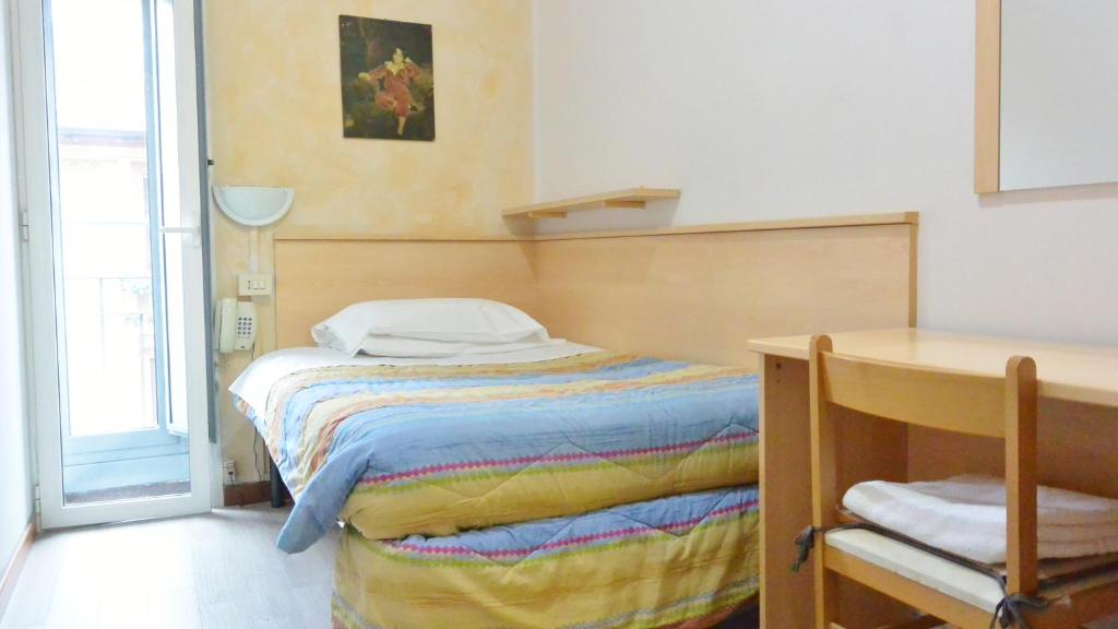 Postel nebo postele na pokoji v ubytování Hotel Arno