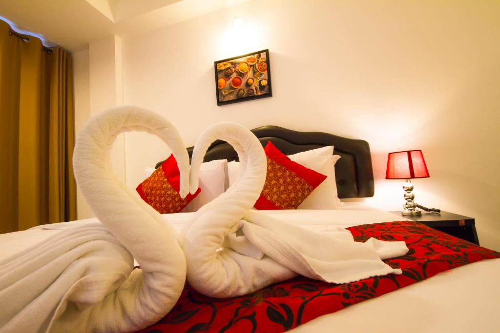Postel nebo postele na pokoji v ubytování TH beach hotel