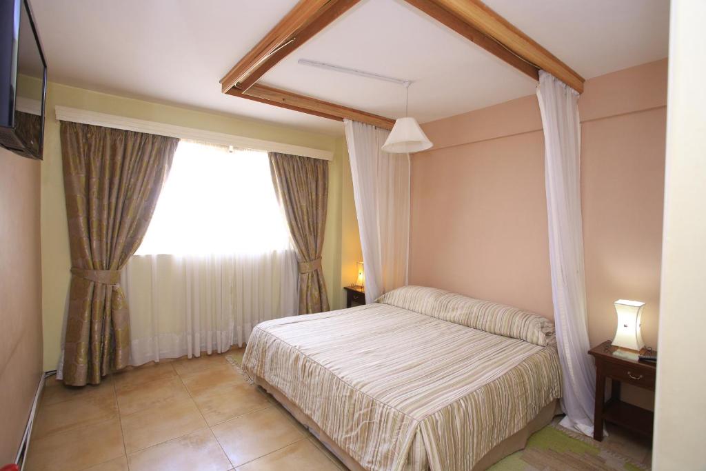 Postel nebo postele na pokoji v ubytování Hillpark Hotel