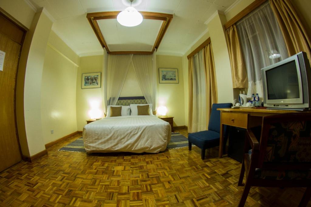 Postel nebo postele na pokoji v ubytování Hillpark Hotel