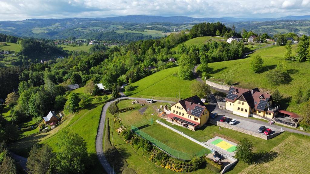 an aerial view of a house on a hill at Penzion Hamštejn in Koberovy