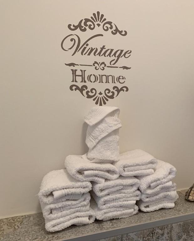 a pile of towels on a counter in a bathroom at LieblingsOrt in Neusiedl am See