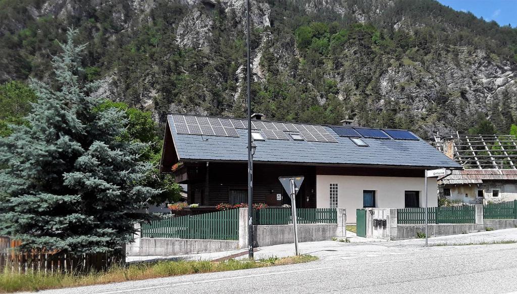 a house with solar panels on top of it at Casa Vacanze Da Ile 2 in Malborghetto Valbruna