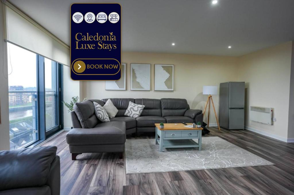 a living room with a couch and a table at The Lancefield Luxe in Glasgow