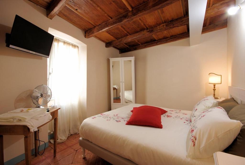 Rúm í herbergi á Guest House Al Castello
