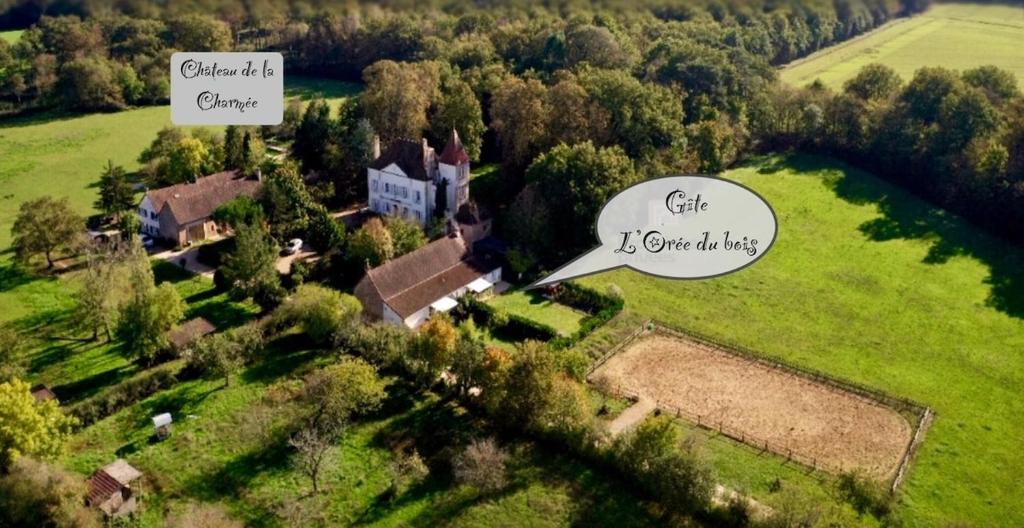 an aerial view of a house and a field at L'Orée du Bois in La Charmée
