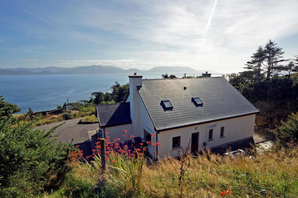 a house on top of a hill next to the ocean at 4 Bed in Inch oc-i183 in Anascaul