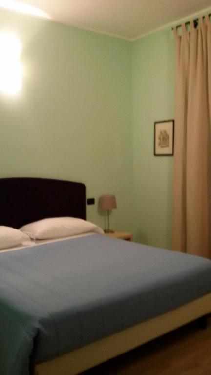 Postel nebo postele na pokoji v ubytování CerrutiHotel