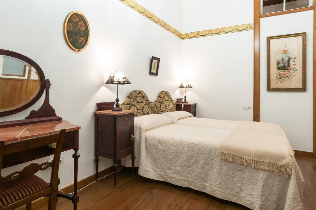 Postel nebo postele na pokoji v ubytování Casa Emblematica Celestino