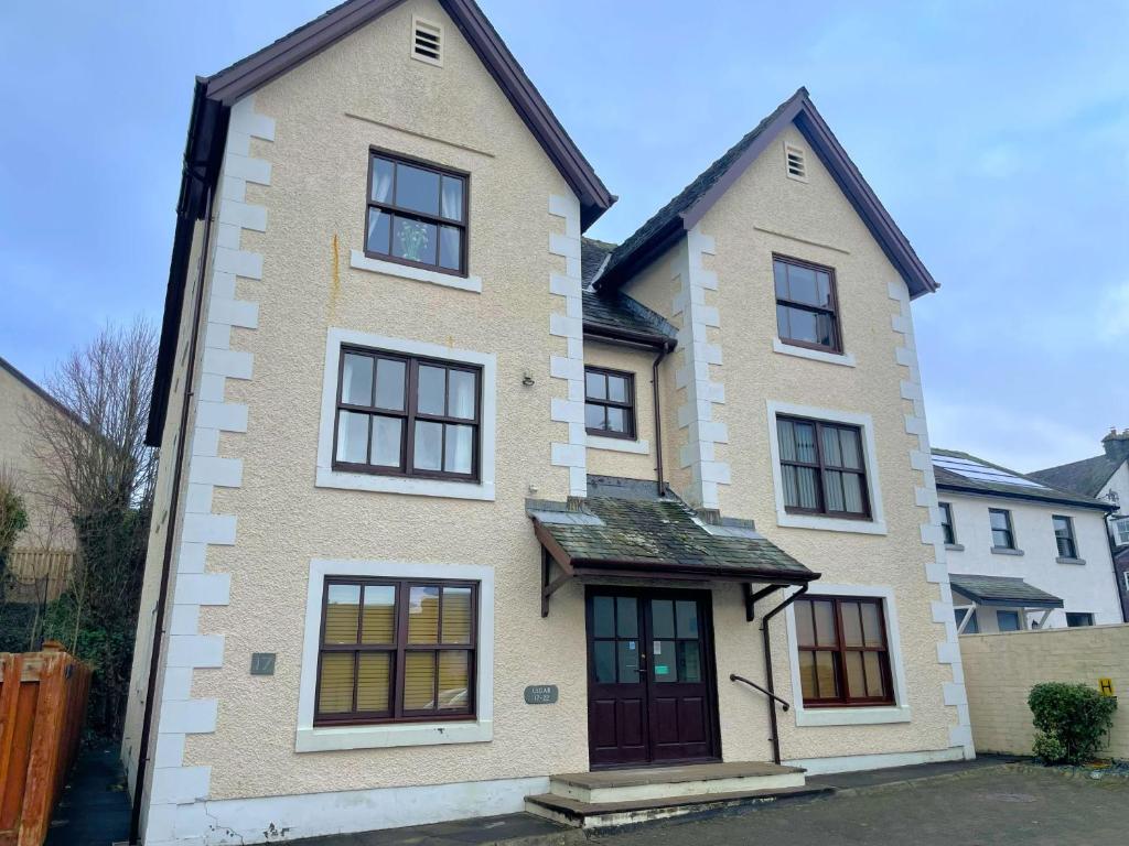 a large brick house with black windows at Catbells in Keswick