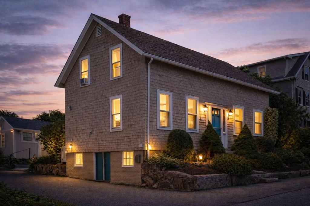 a house with its lights on at night at Stay at East Gloucester in Gloucester