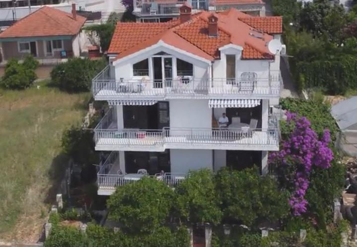 a large white house with a white balcony at Vila Nataly in Trogir