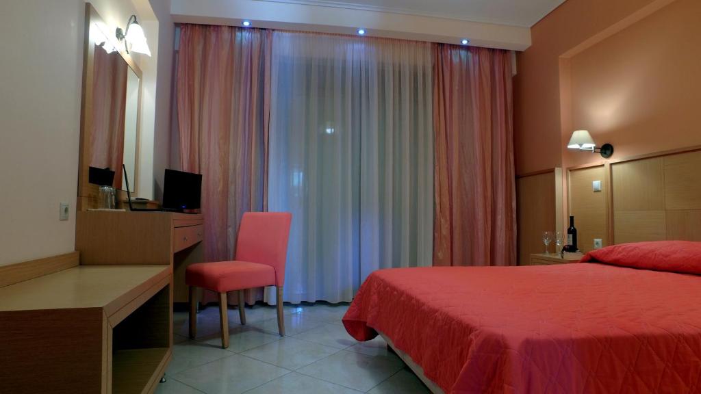 Postel nebo postele na pokoji v ubytování Evia Hotel & Suites