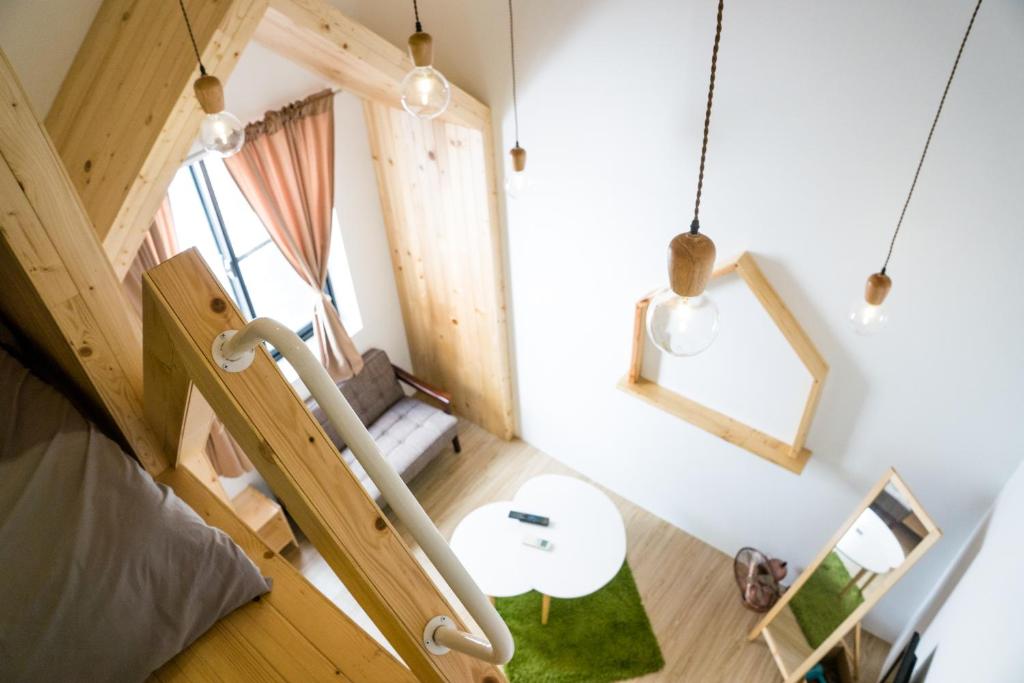 Postel nebo postele na pokoji v ubytování Hinoki Mansion
