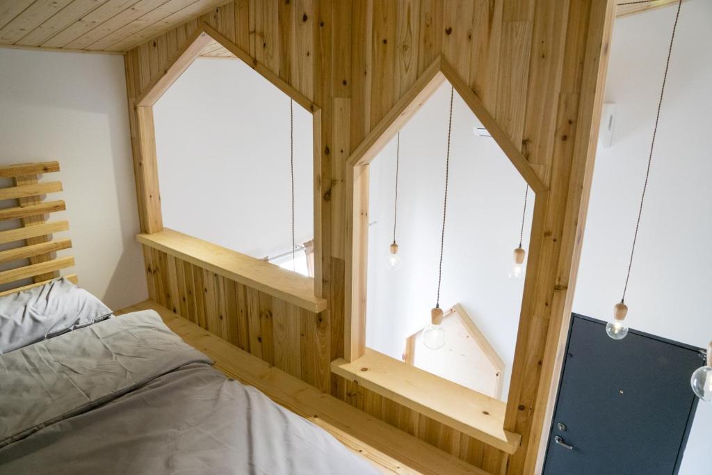 Postel nebo postele na pokoji v ubytování Hinoki Mansion