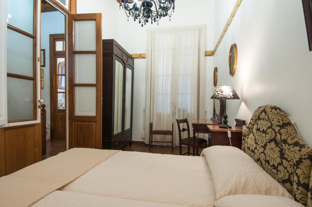 Postel nebo postele na pokoji v ubytování Casa Emblematica Celestino