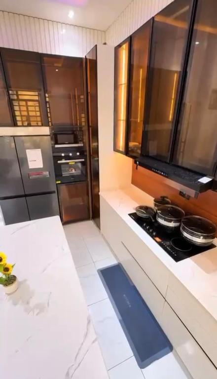 a kitchen with stainless steel appliances and a stove at 5bedroom duplex self compound in Lekki