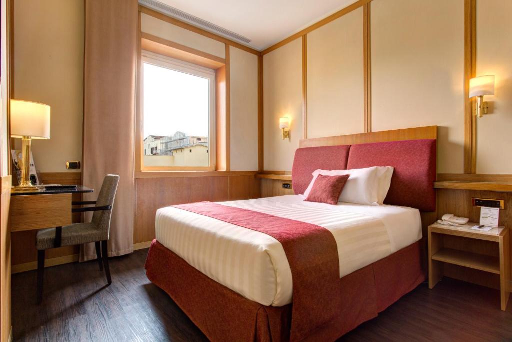 Łóżko lub łóżka w pokoju w obiekcie Best Western Hotel President - Colosseo