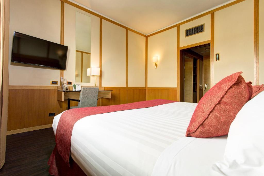 Łóżko lub łóżka w pokoju w obiekcie Best Western Hotel President - Colosseo
