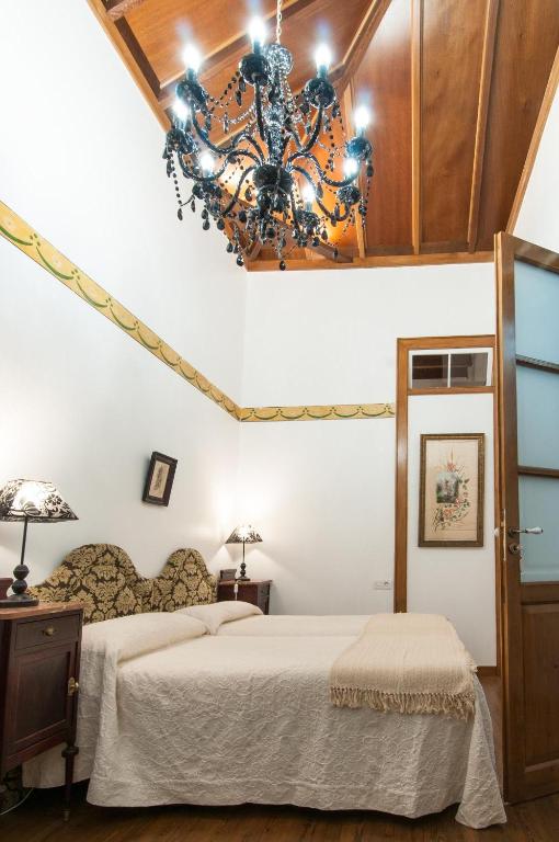 Postel nebo postele na pokoji v ubytování Casa Emblematica Celestino