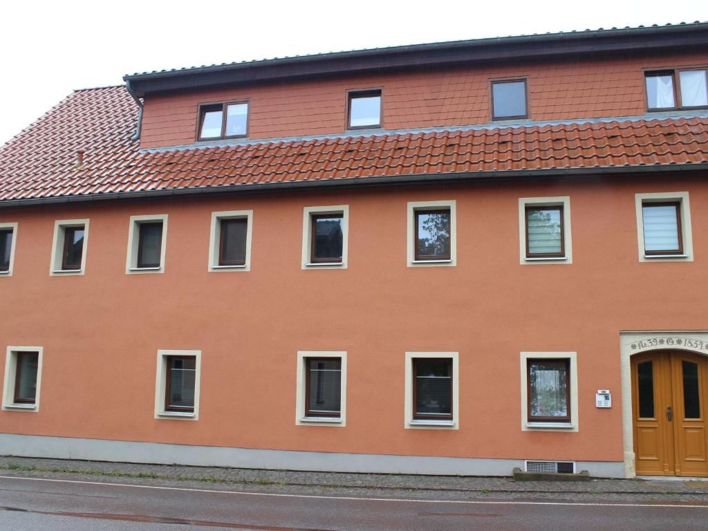 a orange building with a red roof at Apartment Apartment Wuff by Interhome in Altendorf