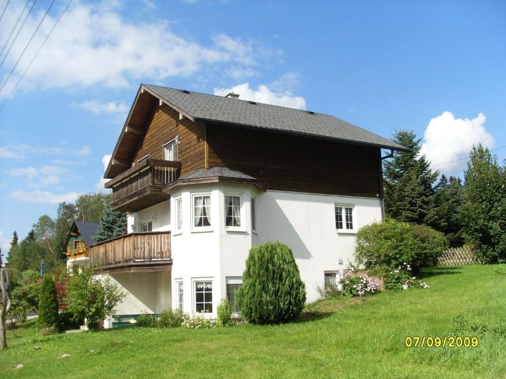 a large white house with a wooden roof at Holiday Home Windrad by Interhome in Auerbach