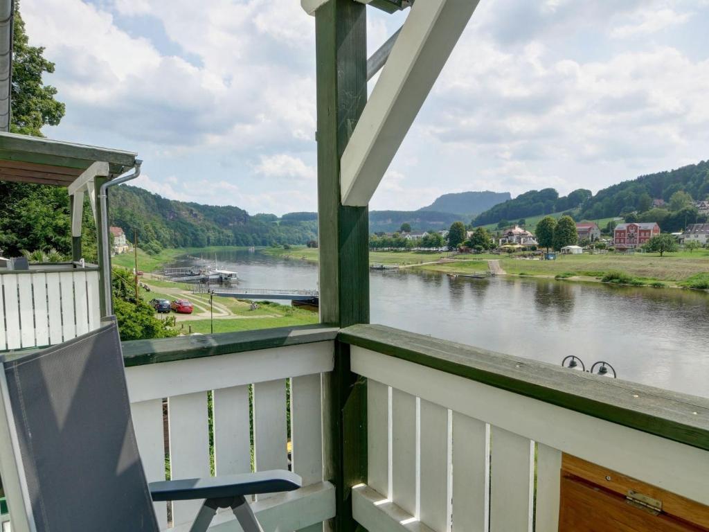a balcony with a view of a river at Apartment Wohnung Lilienstein by Interhome in Kurort Rathen