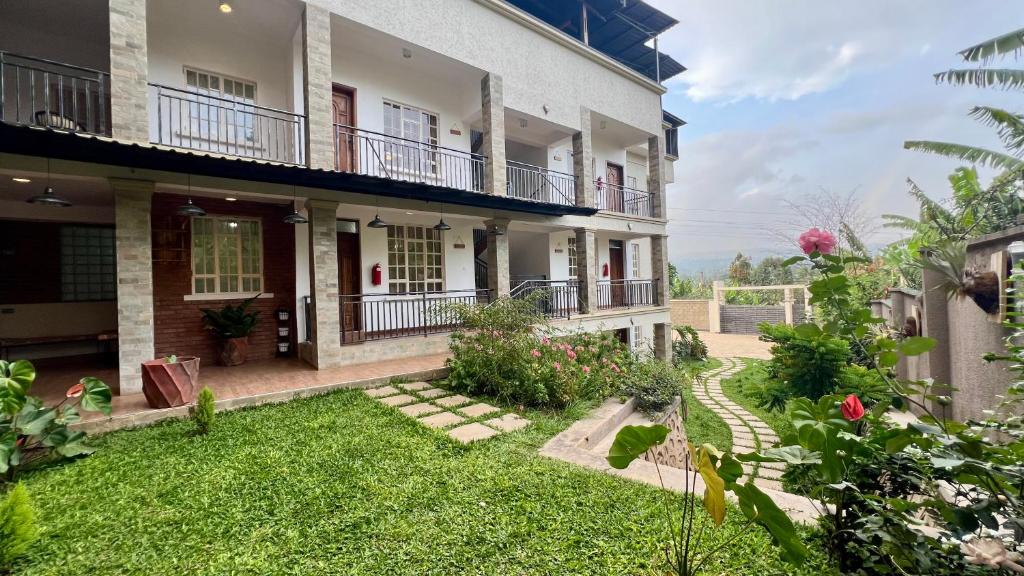 a view of a house with a yard at Iwandaa Boutique Hotel in Nkoanrua