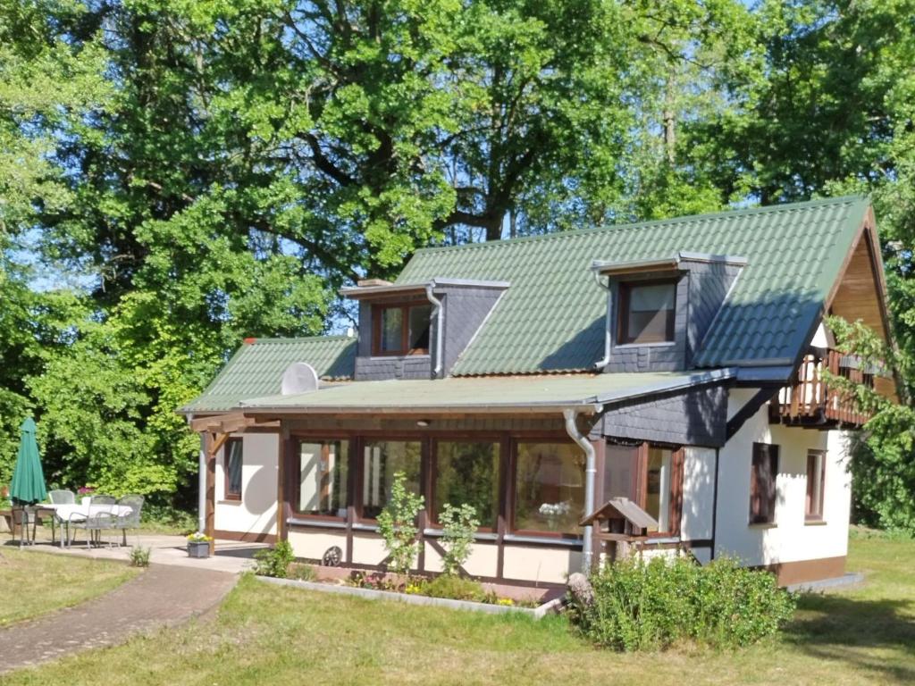 a small house with a green roof at Holiday Home Itzinger by Interhome in Ziesar