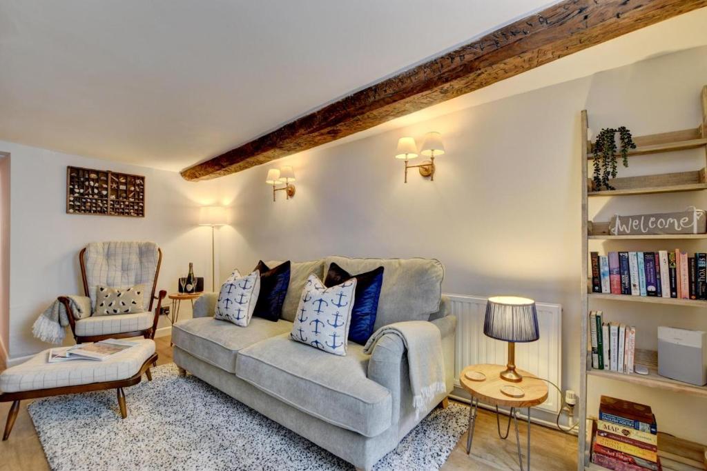 a living room with a couch and a chair at 2 Bed in Appledore oc-whimbc in Appledore