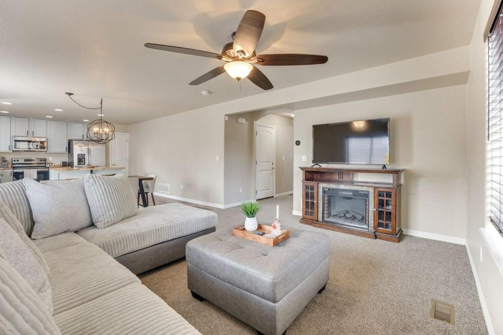 a living room with a couch and a fireplace at Private Yard • BBQ • Patio • Sleeps 8 • 4BR in Colorado Springs