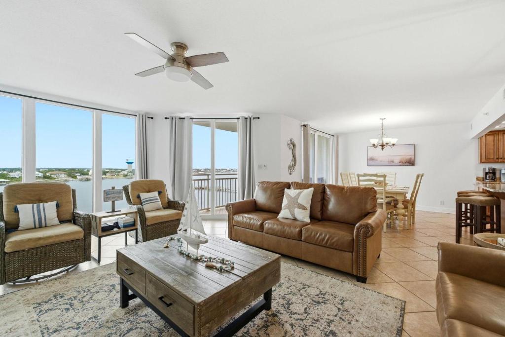 a living room with a couch and a table at SeaSpray Riverside 712 in Perdido Key