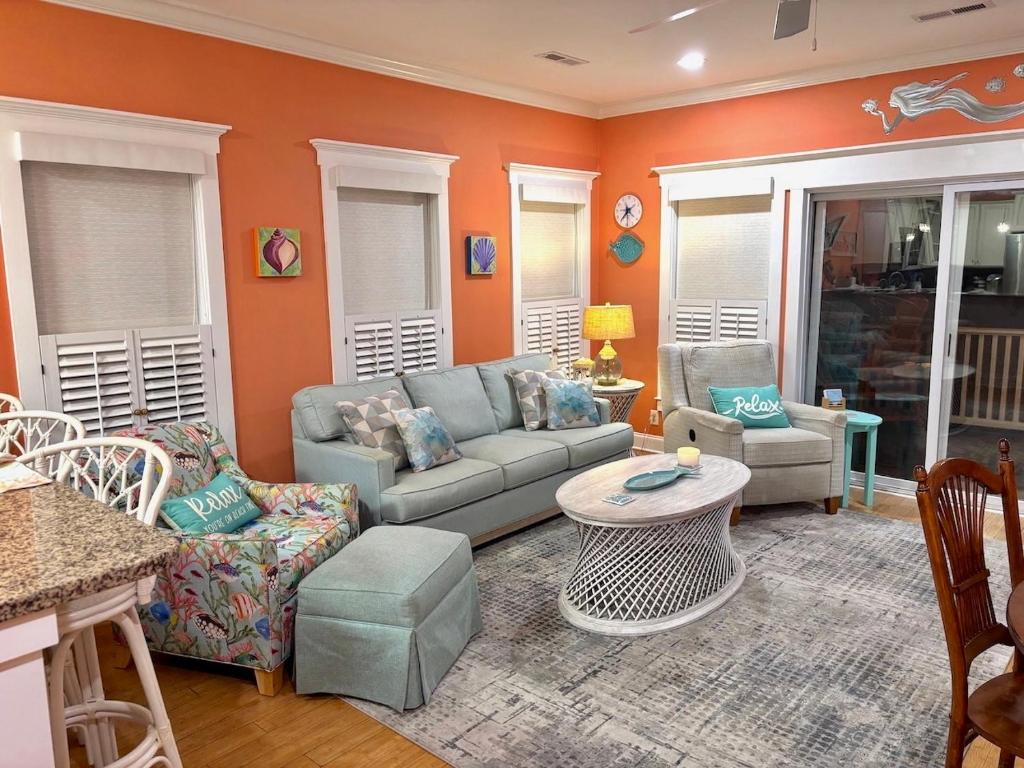 a living room with a couch and a table at Happy Hours in Carolina Beach