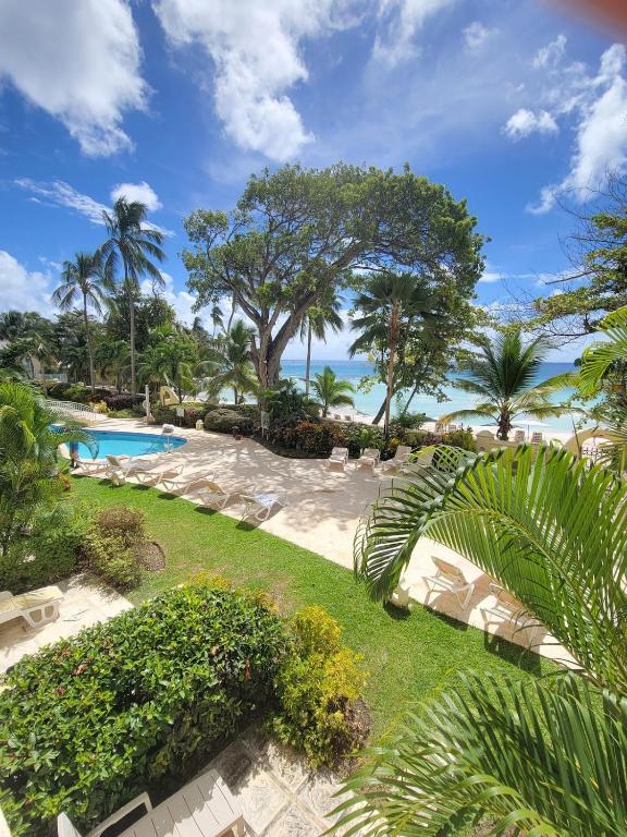 an aerial view of a resort with a swimming pool at 108 Sapphire Beach Condos Barbados in Christ Church