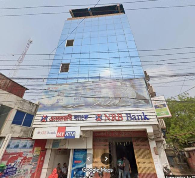 a building with a sign on the front of a store at MD HoTEL in Iswardi
