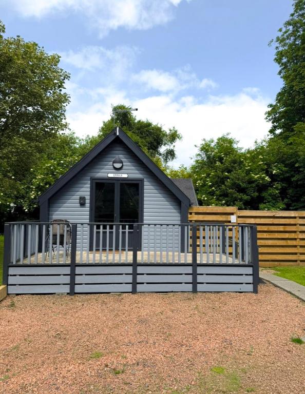 a small house with a fence in front of it at Epona 8 - Hot Tub-Perth-Pets-Luxury in Perth