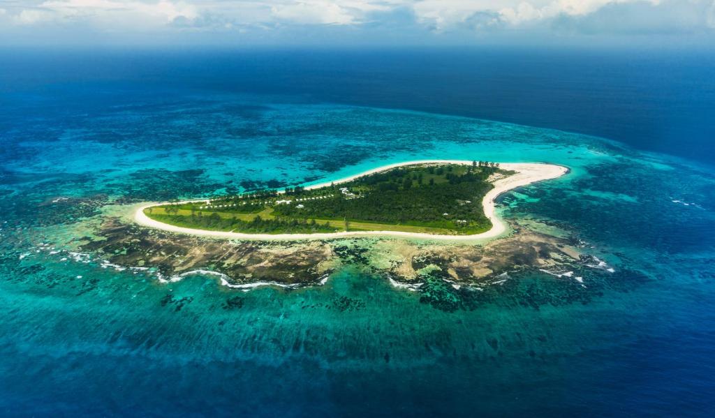 an island in the middle of the ocean at Bird Island Seychelles - Private Island Villas in Bird Island