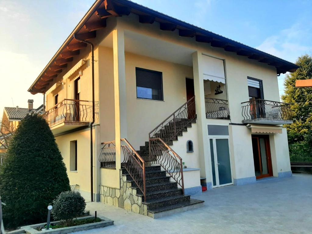 a house with stairs on the side of it at la casa di Shanti in Avigliana