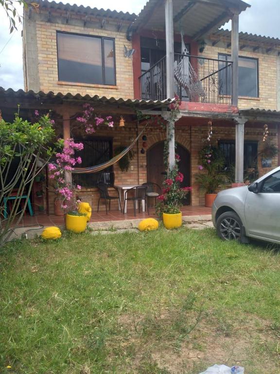a house with pumpkins in front of it at Casa Oliva in Sáchica