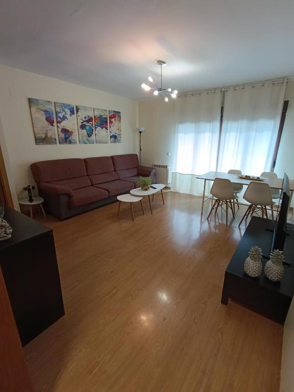 a living room with a couch and a table at Piso Rualte in Ávila