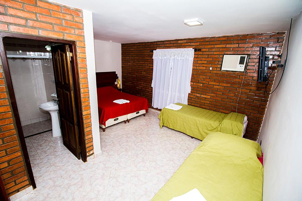 Postel nebo postele na pokoji v ubytování Posada Madre America